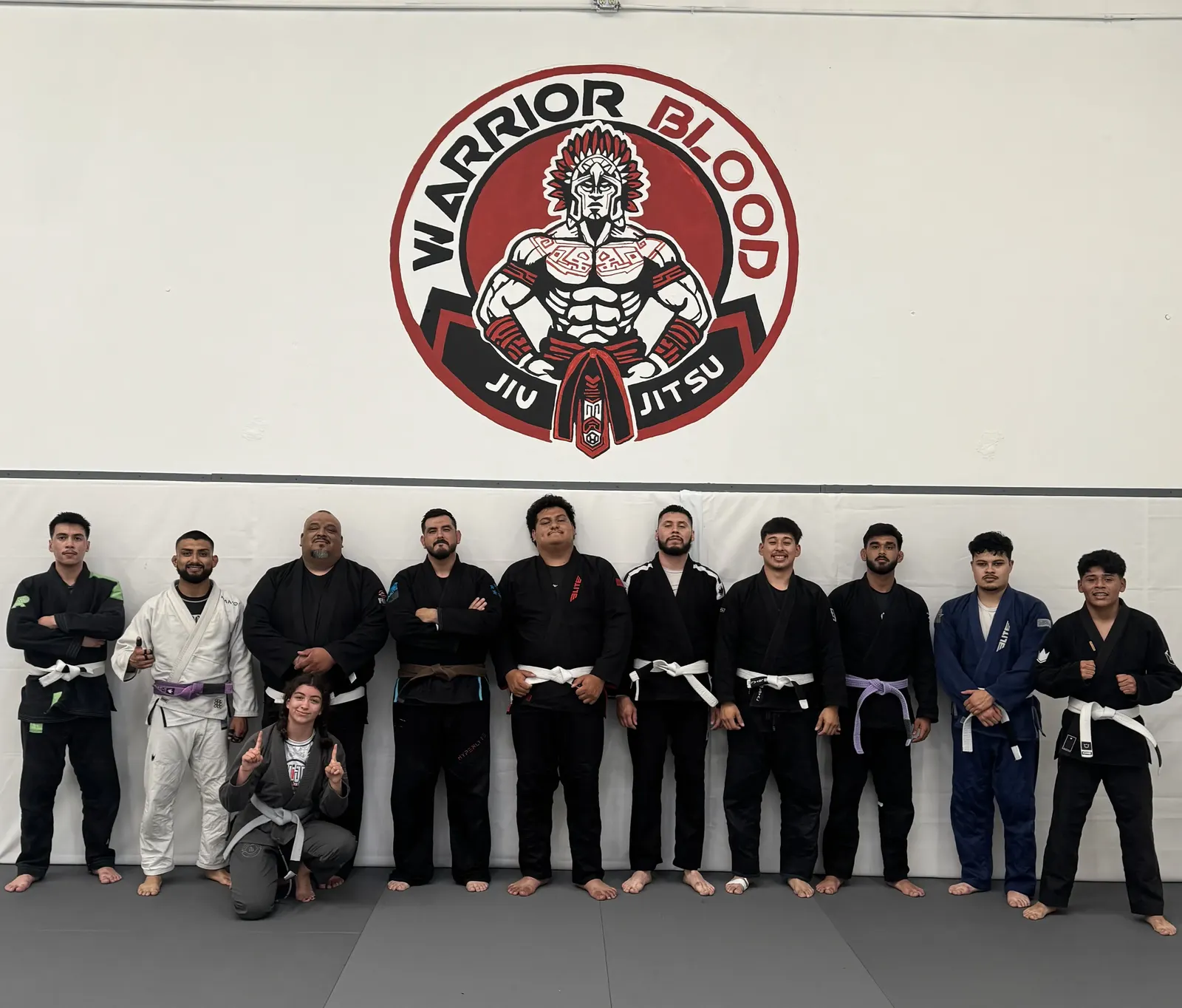 A gi class lined up at Warrior Blood Jiu Jitsu